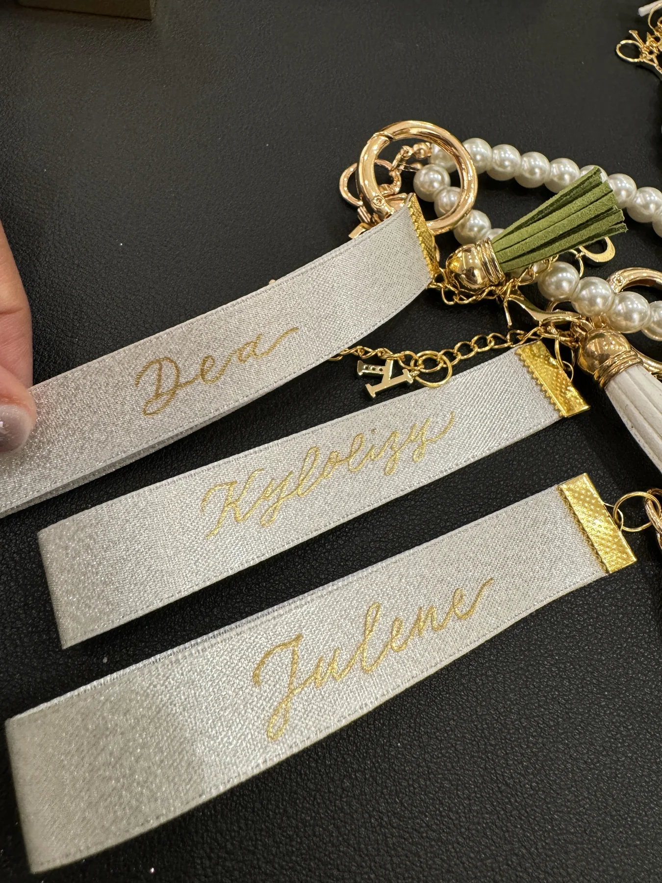Gold names on leather tags