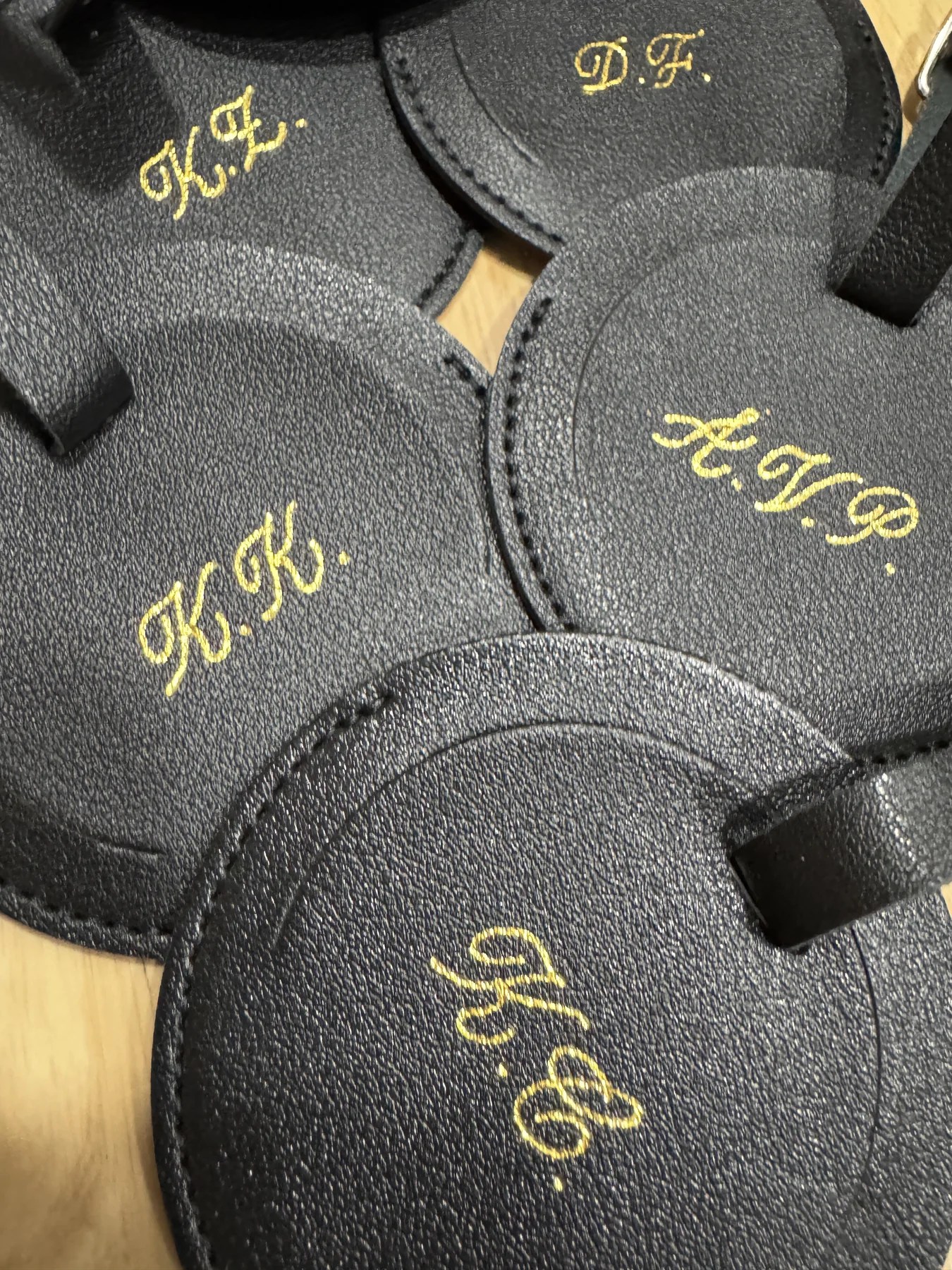 Gold hot-foiled initials on leather tags