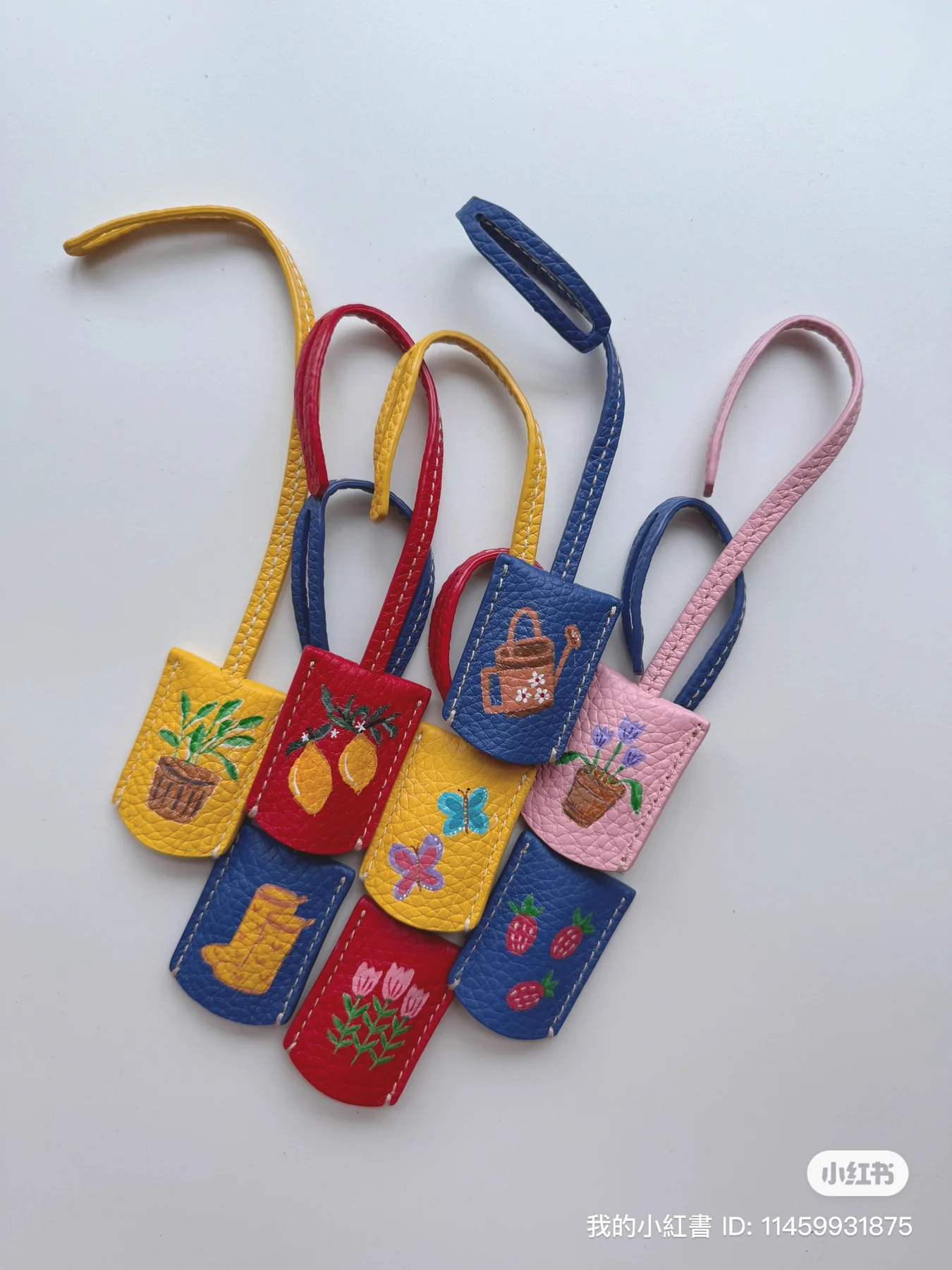 Collection of hand-painted leather tags